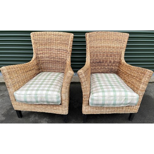 587 - Pair of rattan conservatory chairs with shaped backs and outsplayed arms on square supports, loose s... 