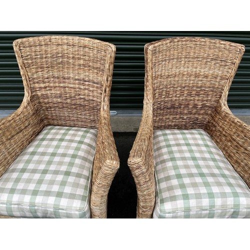 587 - Pair of rattan conservatory chairs with shaped backs and outsplayed arms on square supports, loose s... 