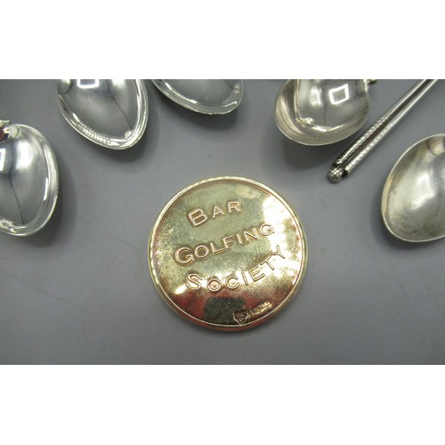 563 - Seven hallmarked Sterling silver teaspoons with golfing finials, engraved 'Basil little Trophy 1990'... 