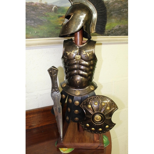 425 - Detailed model of a Roman Centurion with Gladius on stand. 54cm.  A Greek soldier with shield and sw... 