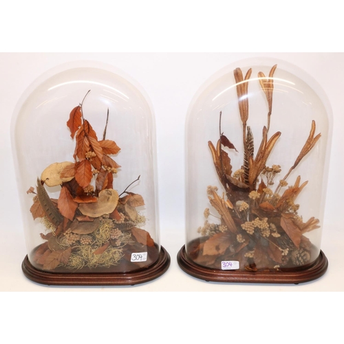 304 - C20th pair of still life studies of dried flowers under glass domes, H48cm