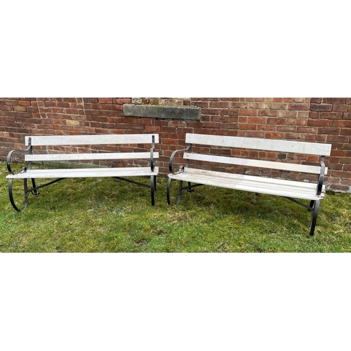 1294 - Pair of wooden slat garden bench seats on scrolled wrought iron end supports, W150cm D63cm H75cm (2)