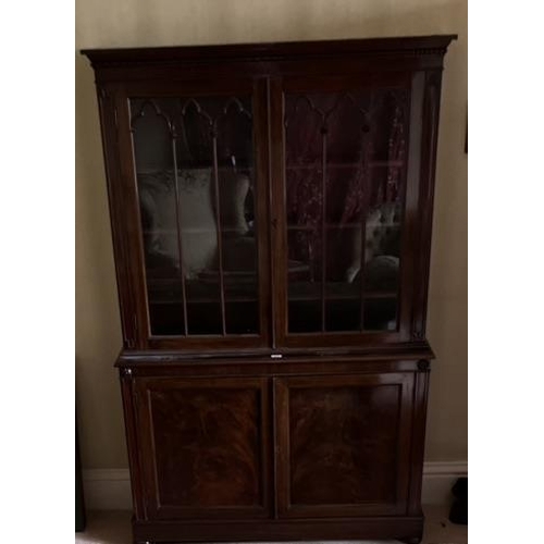 616 - C19th mahogany side cabinet, with lobed cornice above a pair of gothic moulded glazed doors, the bas... 