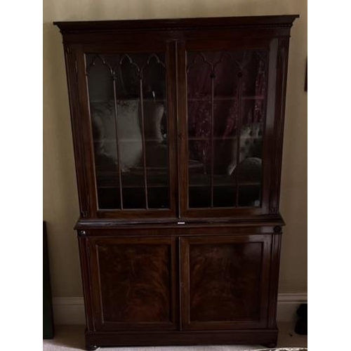 616 - C19th mahogany side cabinet, with lobed cornice above a pair of gothic moulded glazed doors, the bas... 