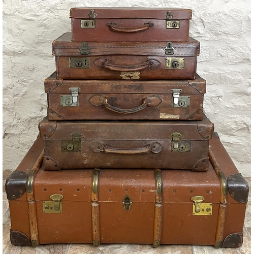 347 - Collection of suitcases, scumbled tin trunk, an initialed wood bound trunk, and a waste paper basket... 