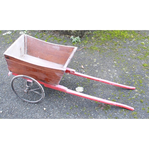 1299 - Child's wooden dog cart with metal spoked wheels 46cm x 32cm, overall length 94cm and a school slate