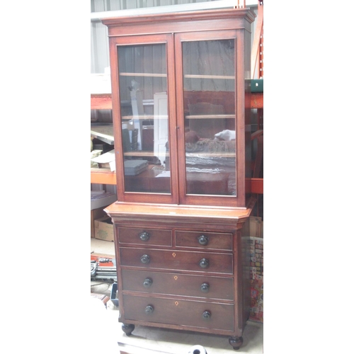 566 - Victorian oak and mahogany bookcase on chest, with two glazed doors above two short and three long g... 