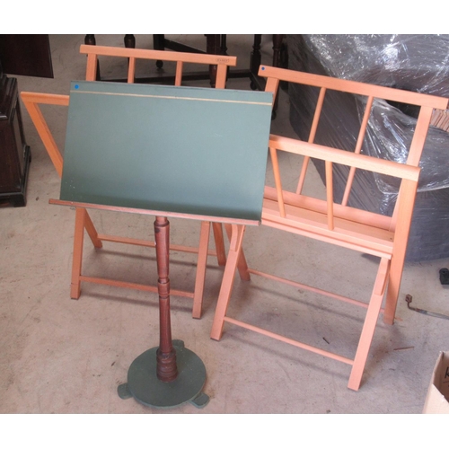 578 - Mabef beech folding folio stand, another similar and a painted music stand, (3)