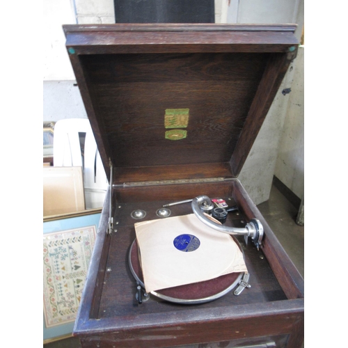 681 - Oak cased gramophone by Perophone Ltd London with lift-up top and two folding panel doors revealing ... 