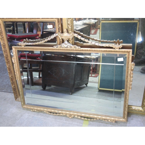 697 - Large gilt framed rectangular bevelled edge wall mirror         72cm x102cm and two other rectangula... 