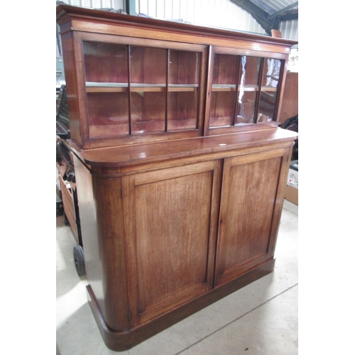 599 - Victorian mahogany side cabinet, moulded cornice and two glazed doors on D shaped base with two cupb... 