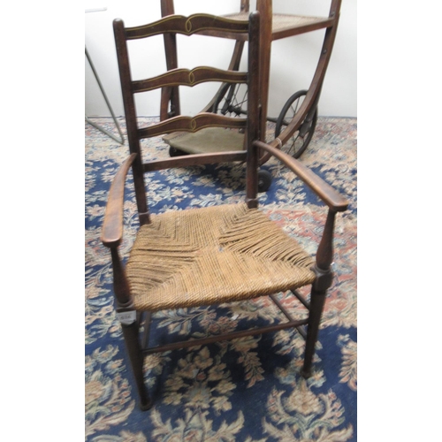 674 - Early C20th childs rush seated ladderback armchair with inlaid detail, H71cm max