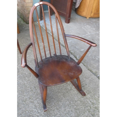 690 - Small Ercol stick back rocking chair in dark wood finish