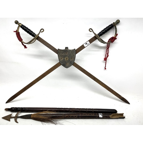 306 - C19th pair of wrought iron firedogs, surveyor's telescopic measure, theodolite tripod, carved oak bo... 