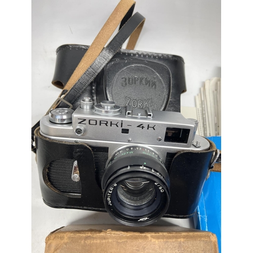 703 - Various collectables incl. a Zorki-4K 35mm camera, world coins, AA car badge, P&O passenger informat... 