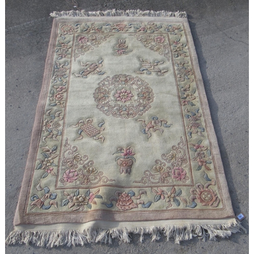 501 - C20th Chinese embossed washed wool rug, cream ground with central medallion and stylised floral repe... 