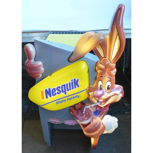 123 - Nestle Nesquik fridge, appears in working order with illuminated front, H101xW56xD61cm