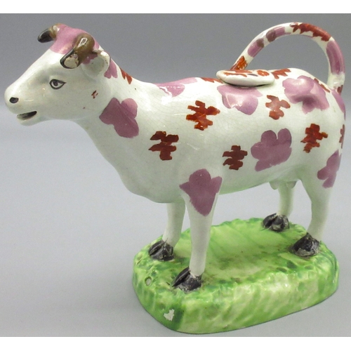 1166 - Early C19th Cambrian Pottery cow creamer, the pink lustre and red enamel spotted animal standing on ... 