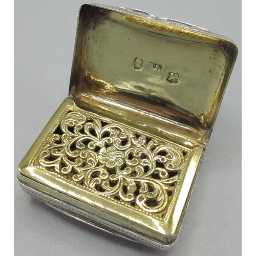 1083 - George 1V silver rectangular vinaigrette, engraved with foliage, lid with vacant cartouche, gilt int... 