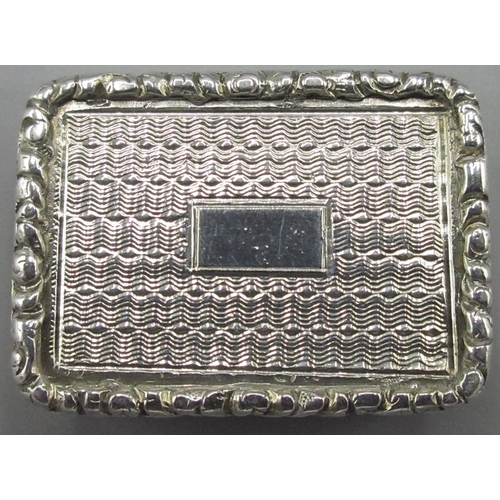 1085 - William 1V silver rectangular vinaigrette, engine turned with raised borders and vacant cartouche, g... 