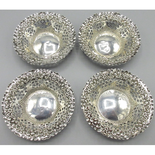 1078 - Pair of late Victorian silver circular bon-bon dishes, with geometric pierced sides and repousse rim... 