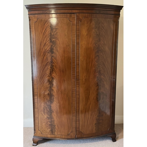 1339 - George III style mahogany bow front wardrobe with Greek Key cornice above two curl veneer panel door... 