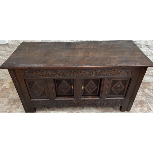 1318 - 18th century oak coffer with later fixed planked top, frieze carved with lozenge, rose and arcades, ... 