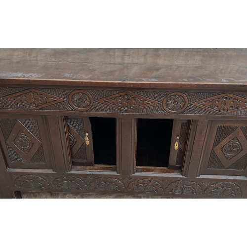 1318 - 18th century oak coffer with later fixed planked top, frieze carved with lozenge, rose and arcades, ... 