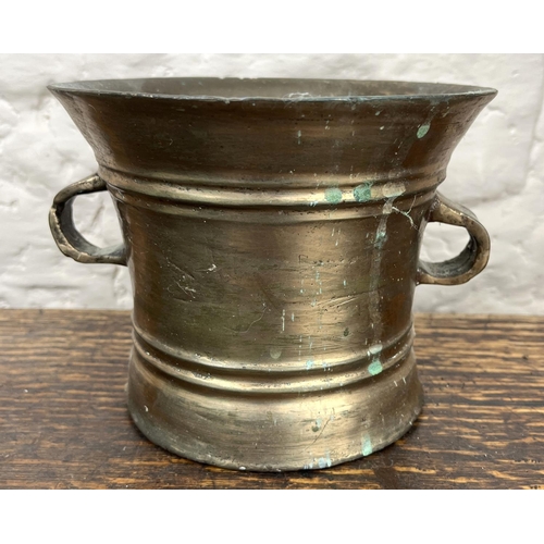 1178 - Large bronze mortar, banded bell-shaped body with two lug handles, H14cm W20cm max