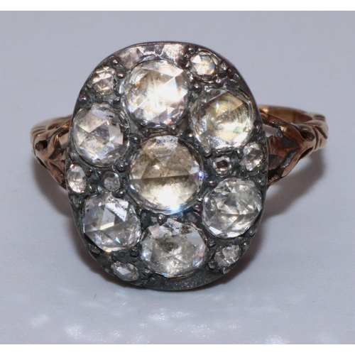 1004 - C18th yellow and white metal diamond cluster ring set with seven large old cut diamonds amongst eigh... 