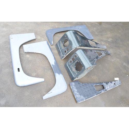 241 - Collection of aluminium Land Rover Defender front body panels to include left and right wings, 2x le... 