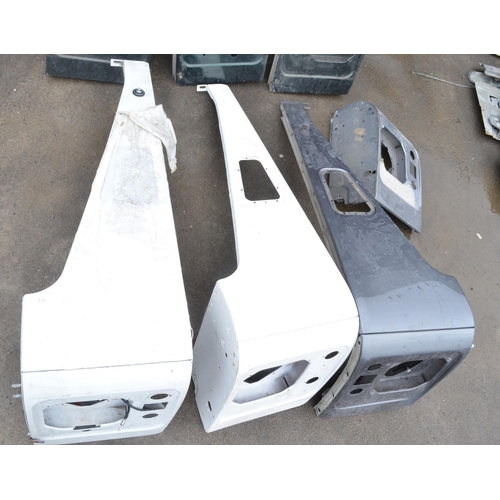 242 - Collection of aluminium Land Rover Defender front upper wing body panels, 3x left and 3x right and a... 