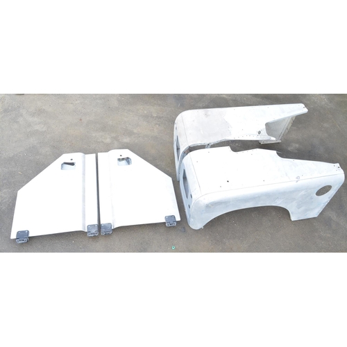 243 - Pair of aluminium Land Rover Defender front wings and pair of doors (4)