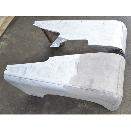 243 - Pair of aluminium Land Rover Defender front wings and pair of doors (4)