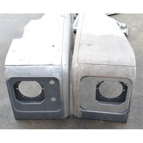 243 - Pair of aluminium Land Rover Defender front wings and pair of doors (4)