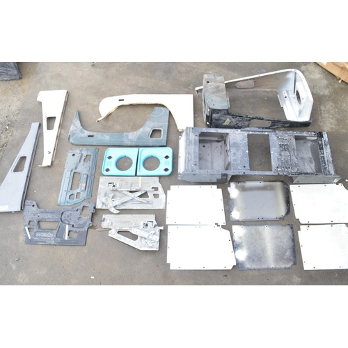 246 - Collection of Land Rover Defender body panels and assemblies to include front right and left top and... 