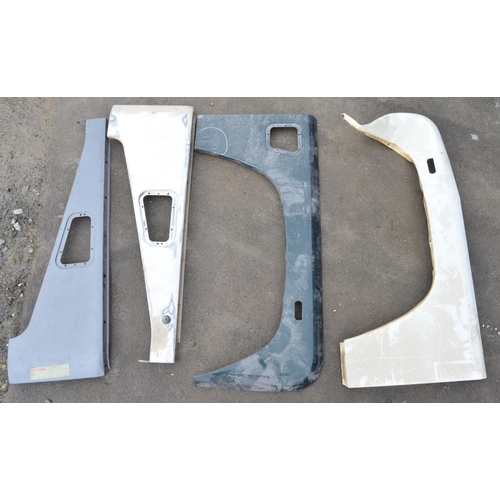 246 - Collection of Land Rover Defender body panels and assemblies to include front right and left top and... 