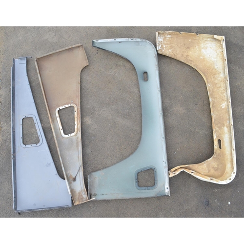 246 - Collection of Land Rover Defender body panels and assemblies to include front right and left top and... 