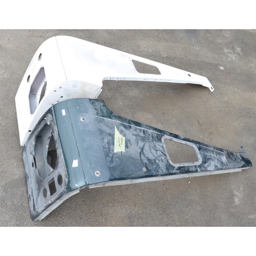 246 - Collection of Land Rover Defender body panels and assemblies to include front right and left top and... 