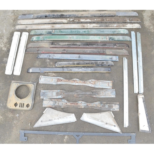 247 - Collection of metal Land Rover Defender trim and other panels and an ABS headlight panel