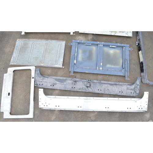 248 - Collection of Land Rover Defender and earlier series aluminium panels, windscreen surrounds, tailgat... 