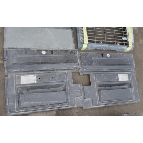 249 - Collection of Land Rover Defender windows, a front grille and other parts (12)