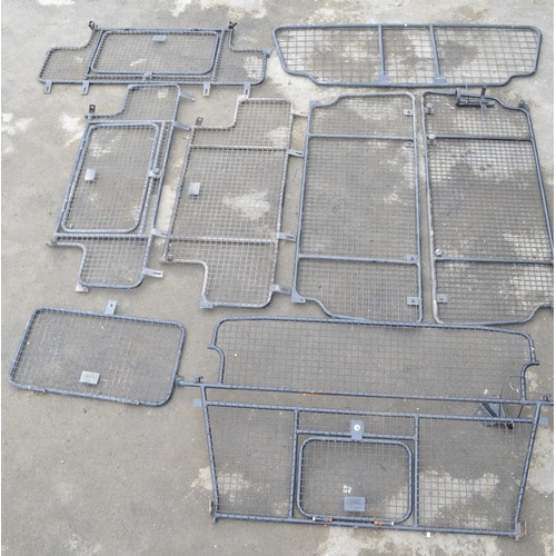 253 - Collection of steel dog guards and/or headache cage panels to include Land Rover branded examples. (... 