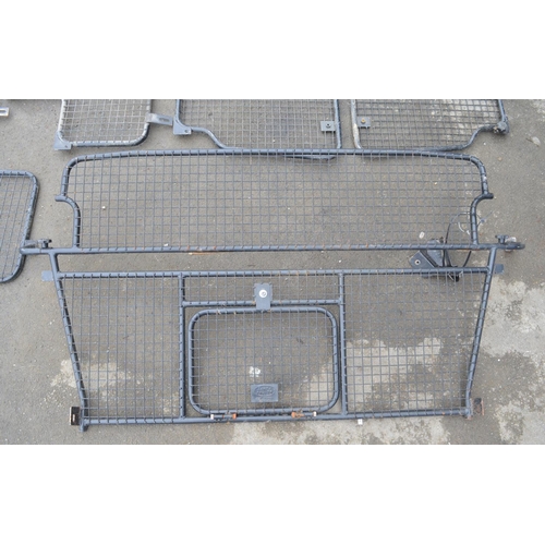 253 - Collection of steel dog guards and/or headache cage panels to include Land Rover branded examples. (... 