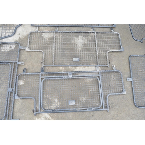 253 - Collection of steel dog guards and/or headache cage panels to include Land Rover branded examples. (... 