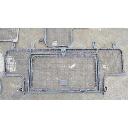 253 - Collection of steel dog guards and/or headache cage panels to include Land Rover branded examples. (... 