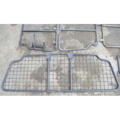 253 - Collection of steel dog guards and/or headache cage panels to include Land Rover branded examples. (... 