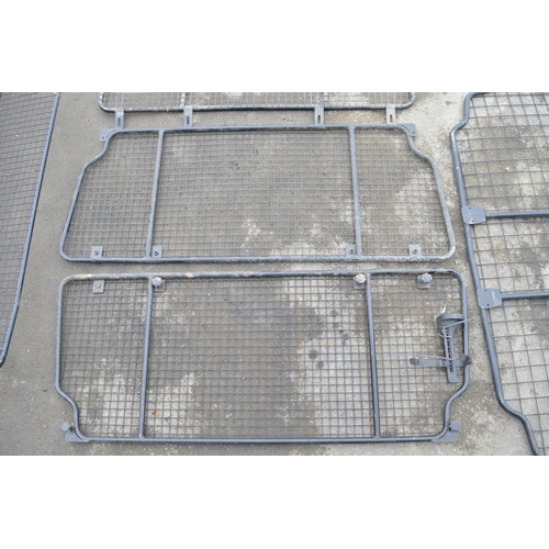 253 - Collection of steel dog guards and/or headache cage panels to include Land Rover branded examples. (... 