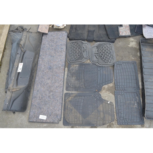 256 - Collection of used mostly Land Rover carpets, mats, 2 sets of seats etc. Qty