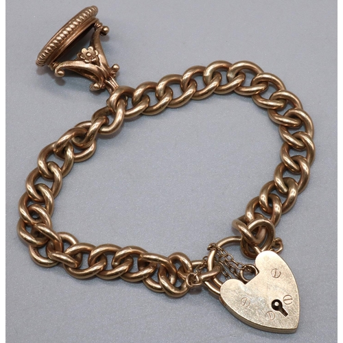 1012 - 9ct yellow gold curb link bracelet with heart shaped padlock closure and safety chain, with attached... 